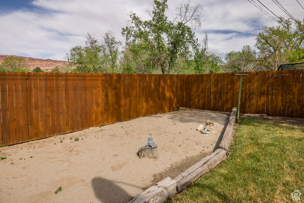 View of yard featuring fence