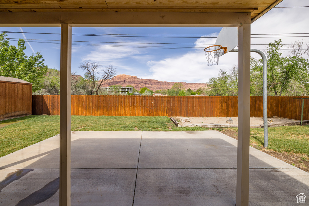 View of patio with a fenced backyard