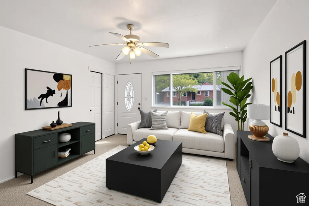 Living room with ceiling fan and light colored carpet