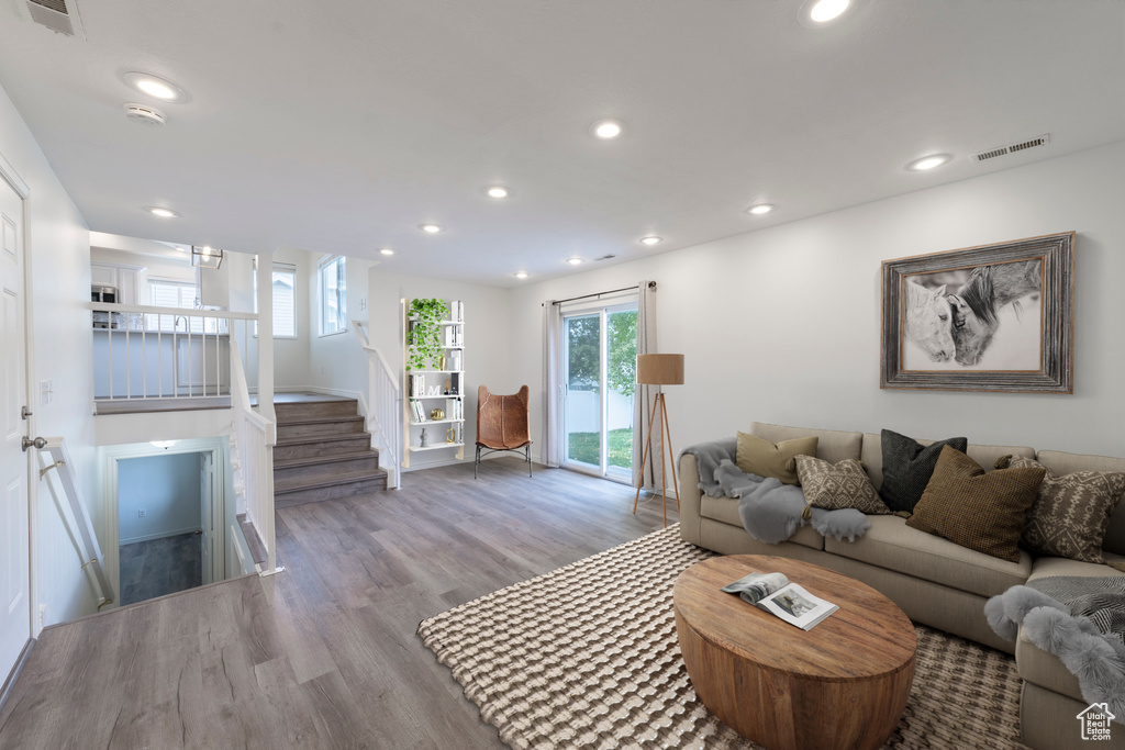 Living room with light hardwood / wood-style flooring