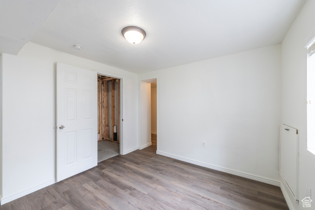 Unfurnished bedroom with hardwood / wood-style floors