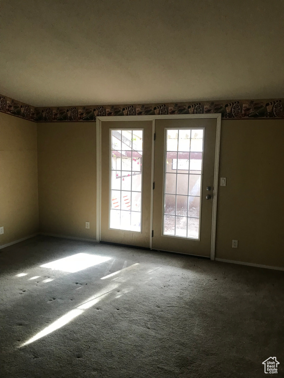 Spare room featuring carpet floors