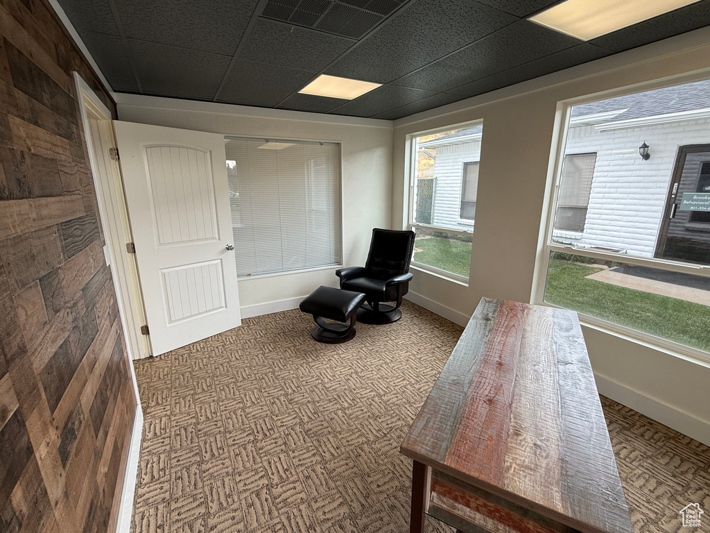 Sitting room with a paneled ceiling