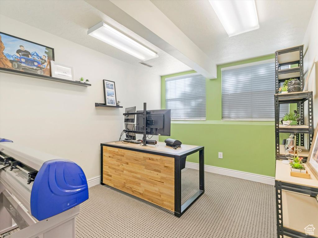 Office area featuring beamed ceiling