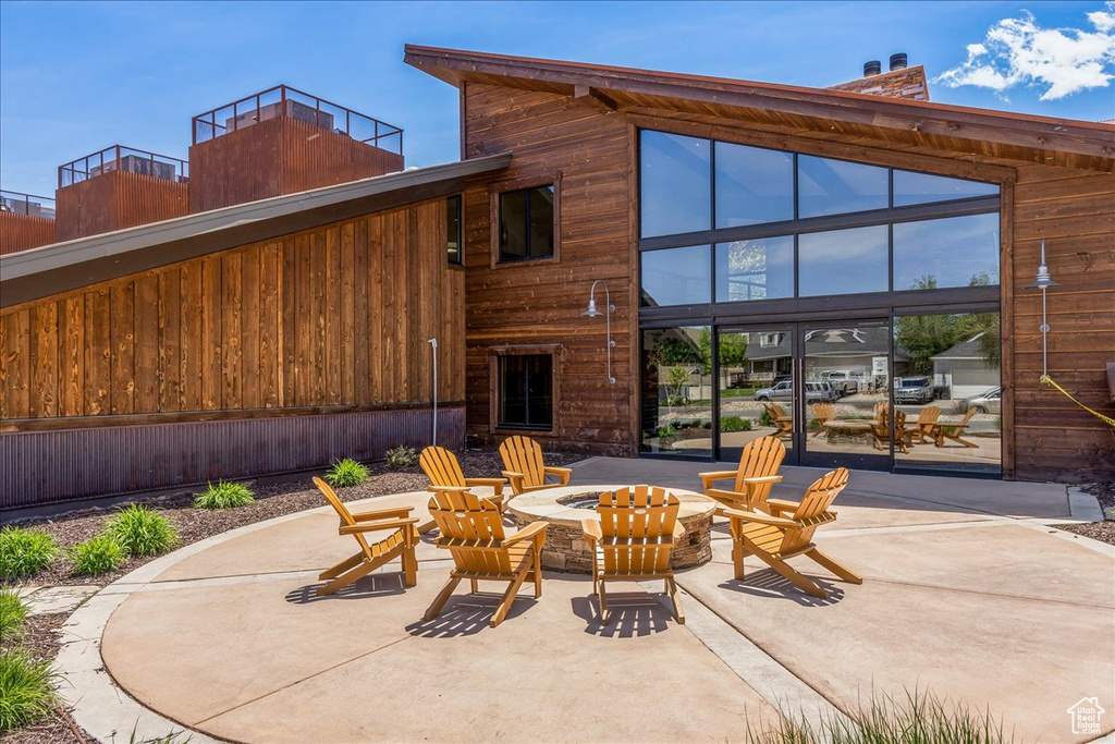 View of patio featuring a fire pit