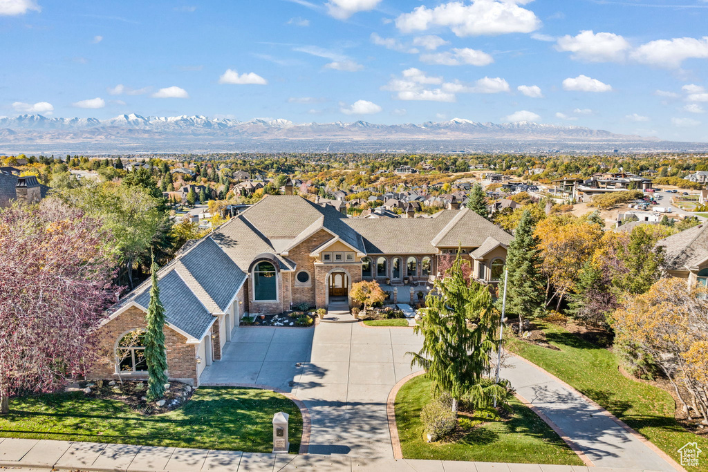 Birds eye view of property with a mountain view