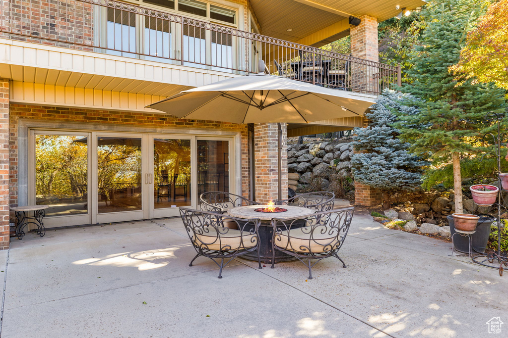 View of patio featuring a balcony