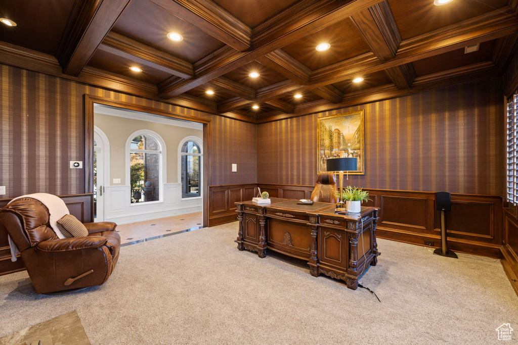 Home office with light colored carpet, beamed ceiling, and coffered ceiling