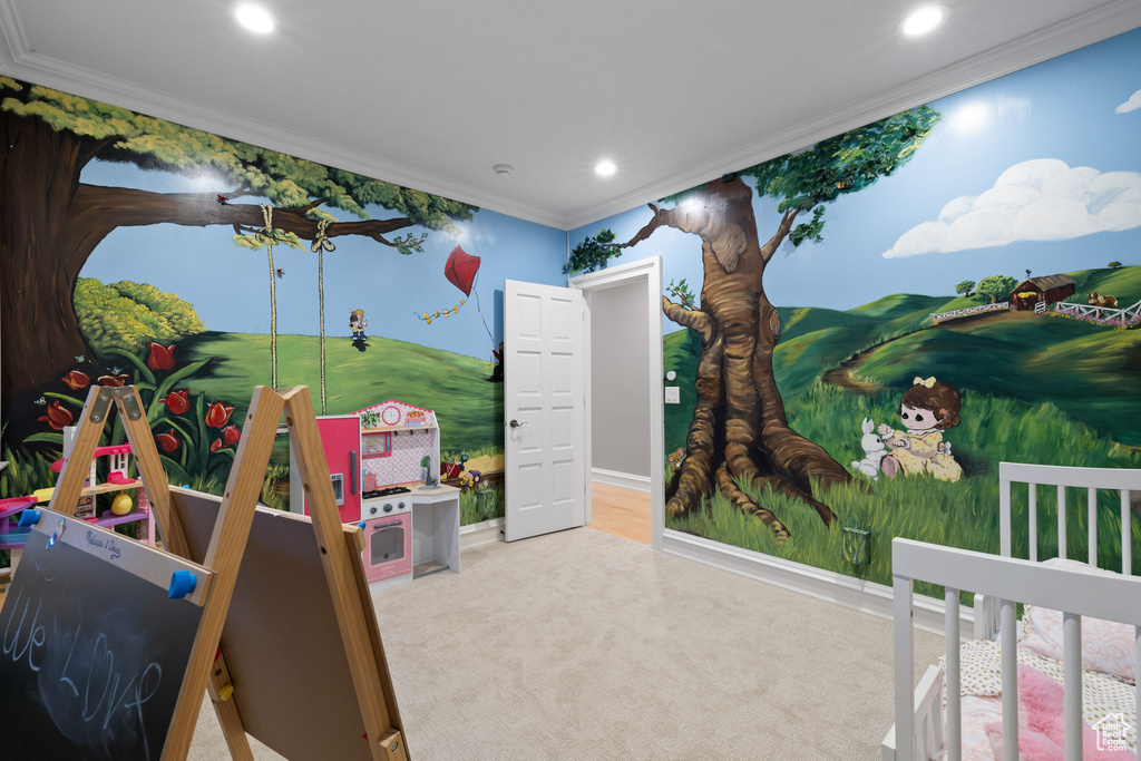 Bedroom featuring carpet and crown molding