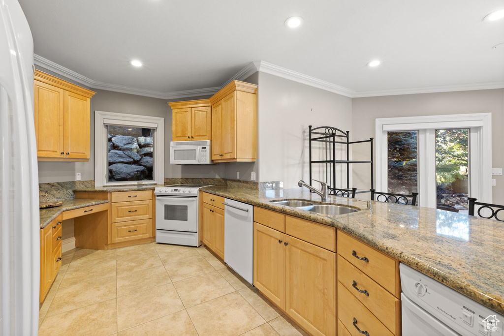 Kitchen with light brown cabinets, white appliances, light stone counters, and ornamental molding