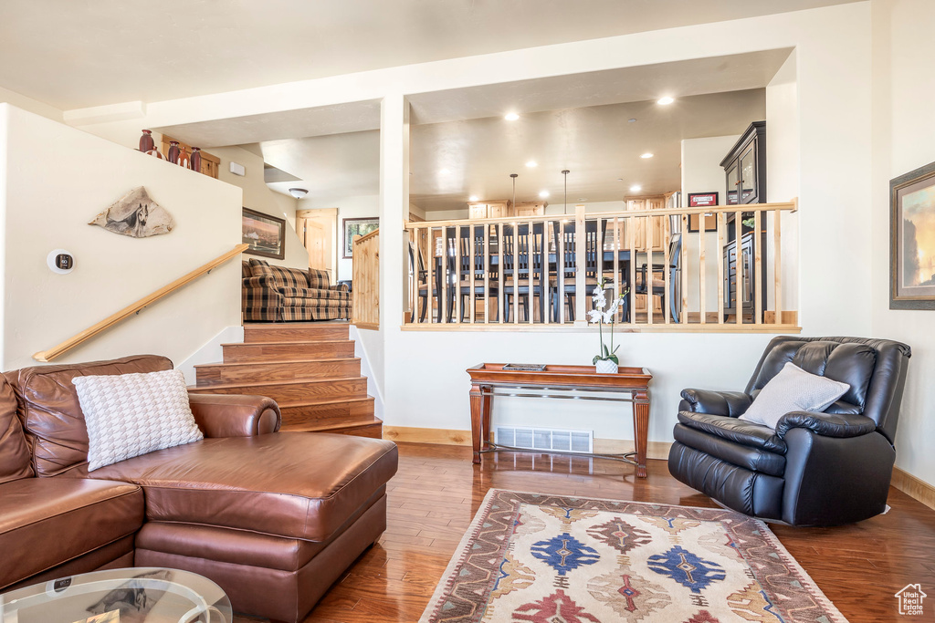 Living room with hardwood / wood-style floors