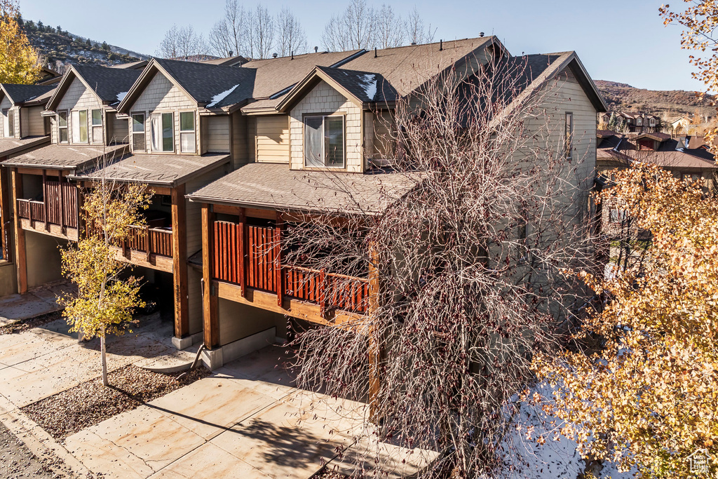 View of front of house featuring a deck with mountain view