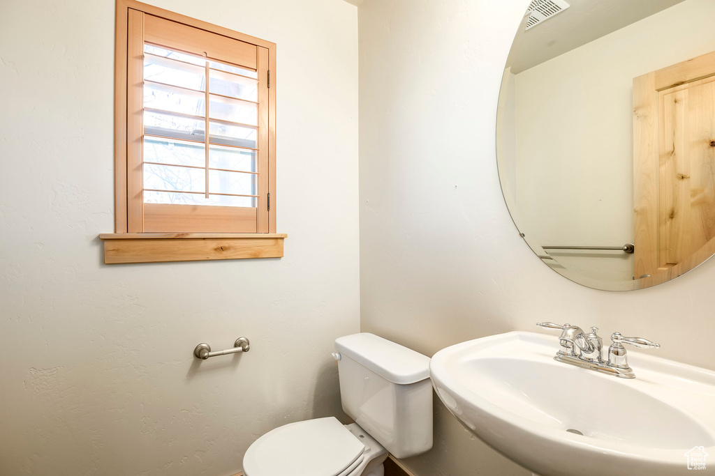 Bathroom featuring sink and toilet