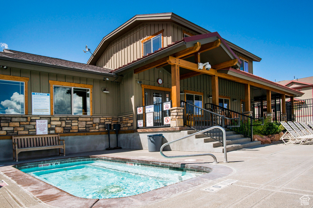 Back of house featuring a pool