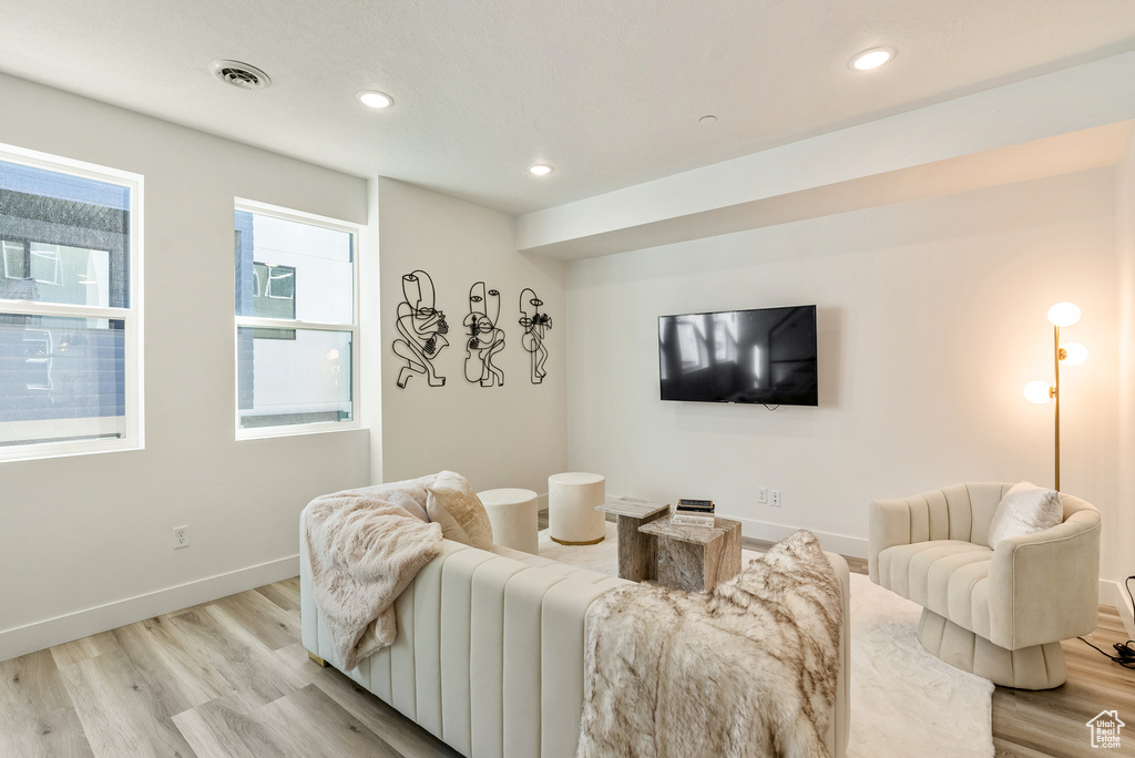 Living room with light hardwood / wood-style floors