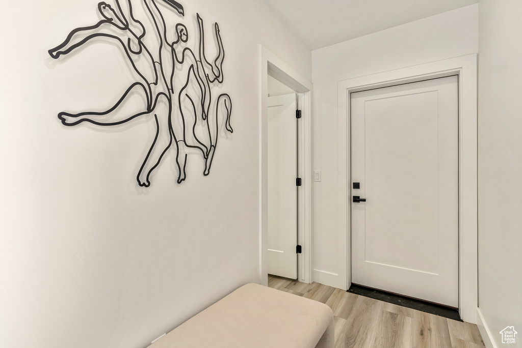 Doorway to outside featuring light hardwood / wood-style flooring