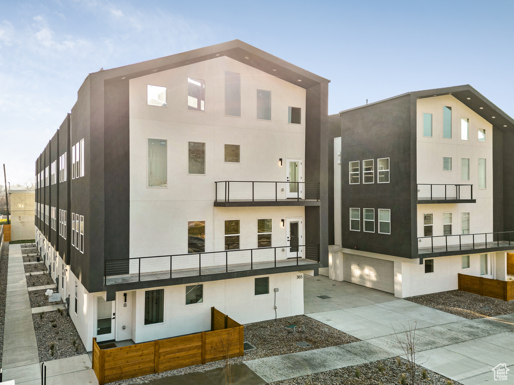 View of building exterior featuring a garage