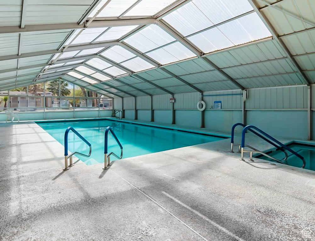 Community pool featuring a patio