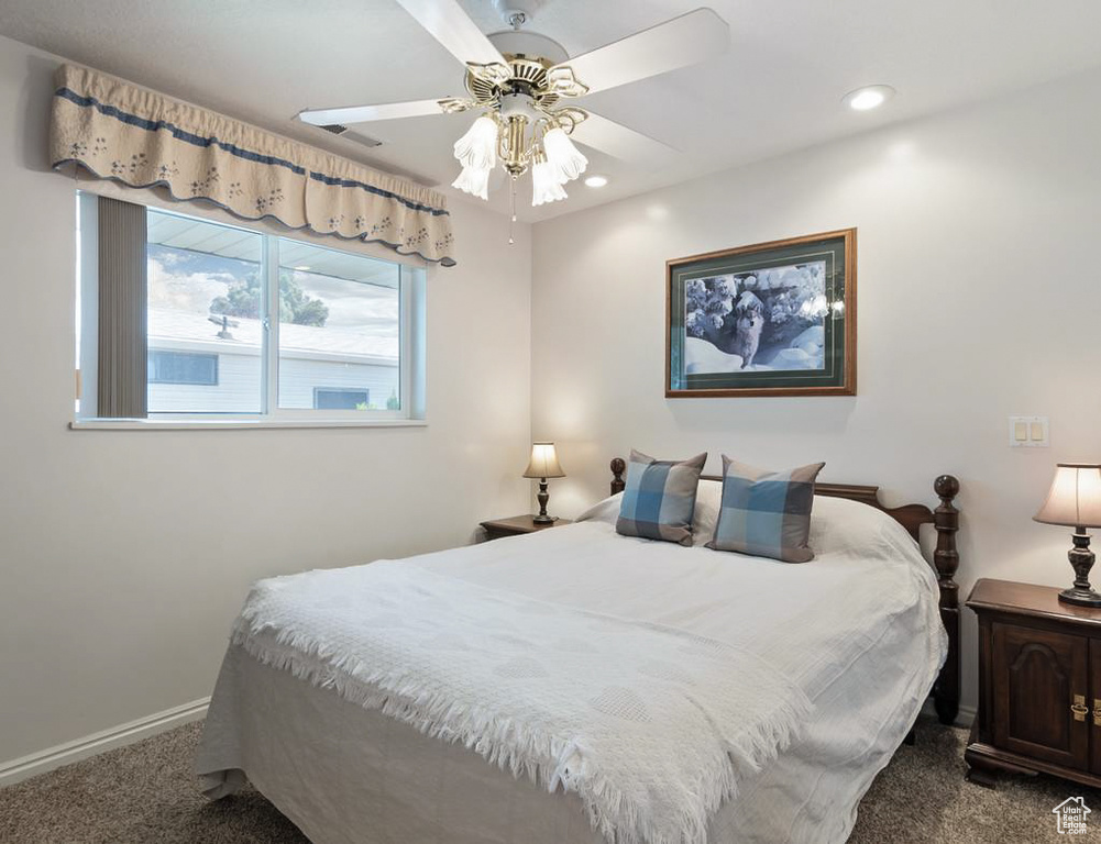 Bedroom with baseboards, recessed lighting, carpet flooring, and ceiling fan
