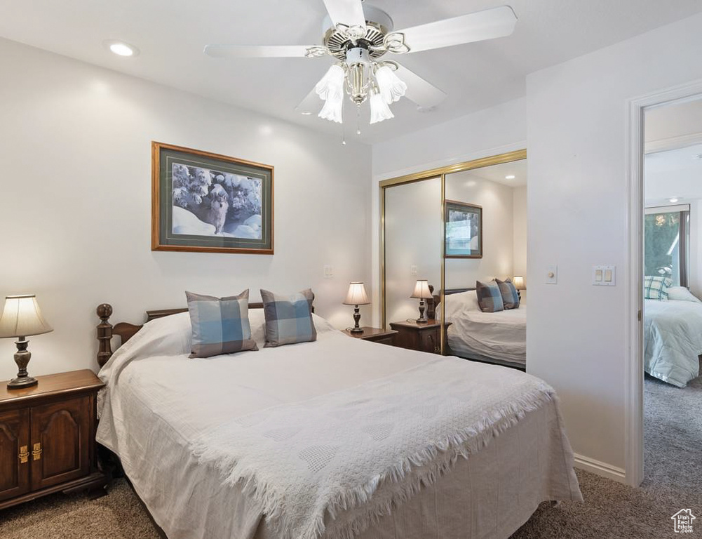 Bedroom with a closet, ceiling fan, recessed lighting, and carpet flooring