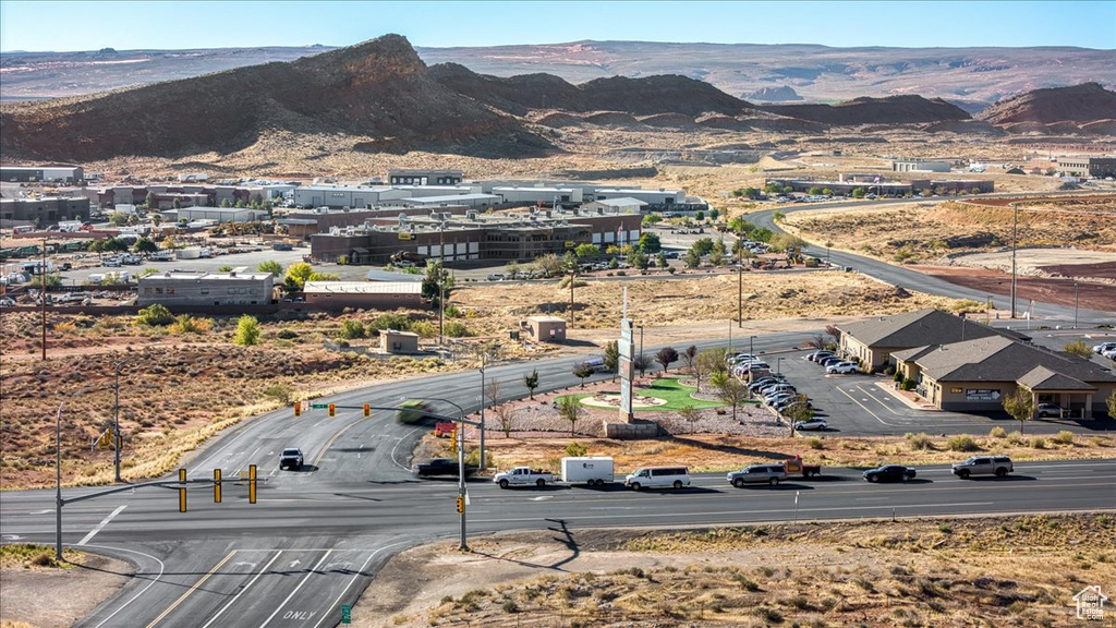 Birds eye view of property with a mountain view