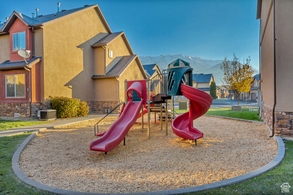 View of jungle gym with a mountain view