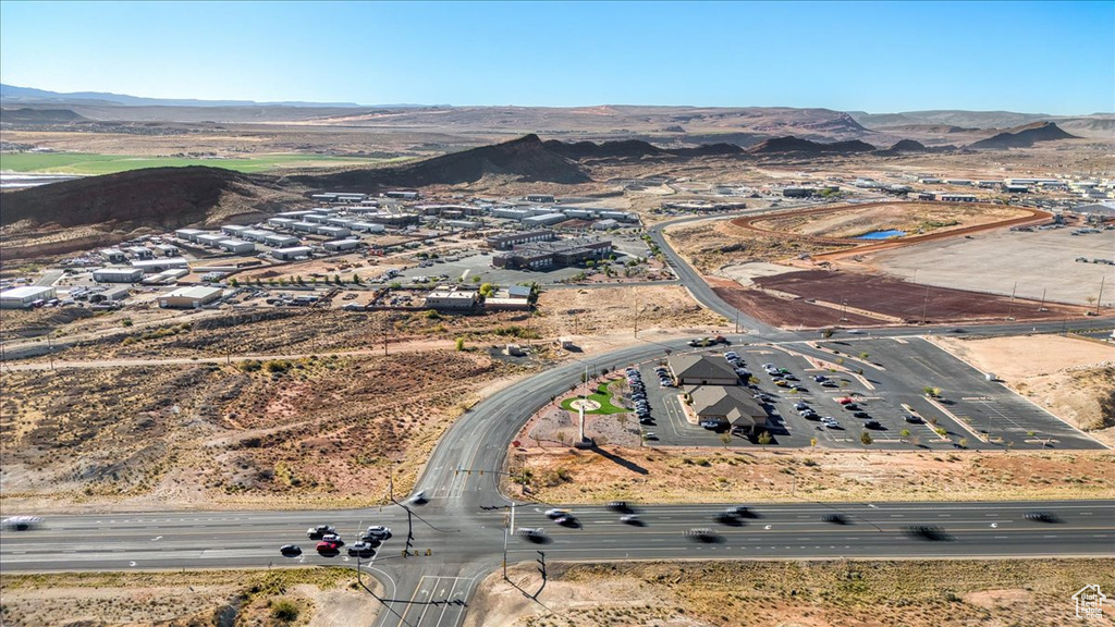 Birds eye view of property with a mountain view