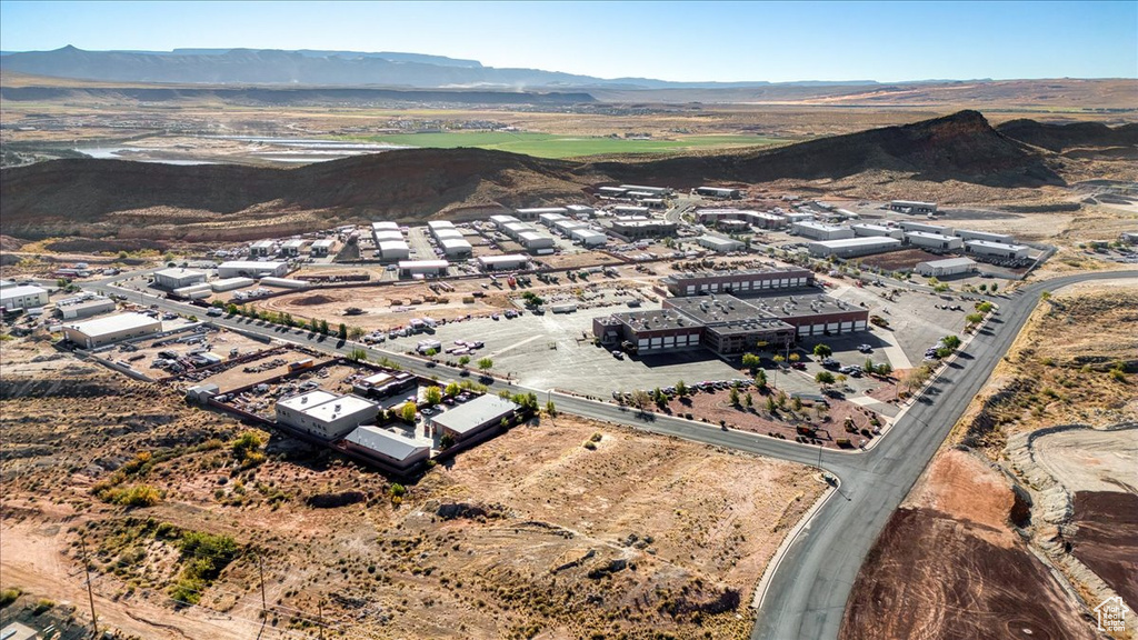 Birds eye view of property with a mountain view