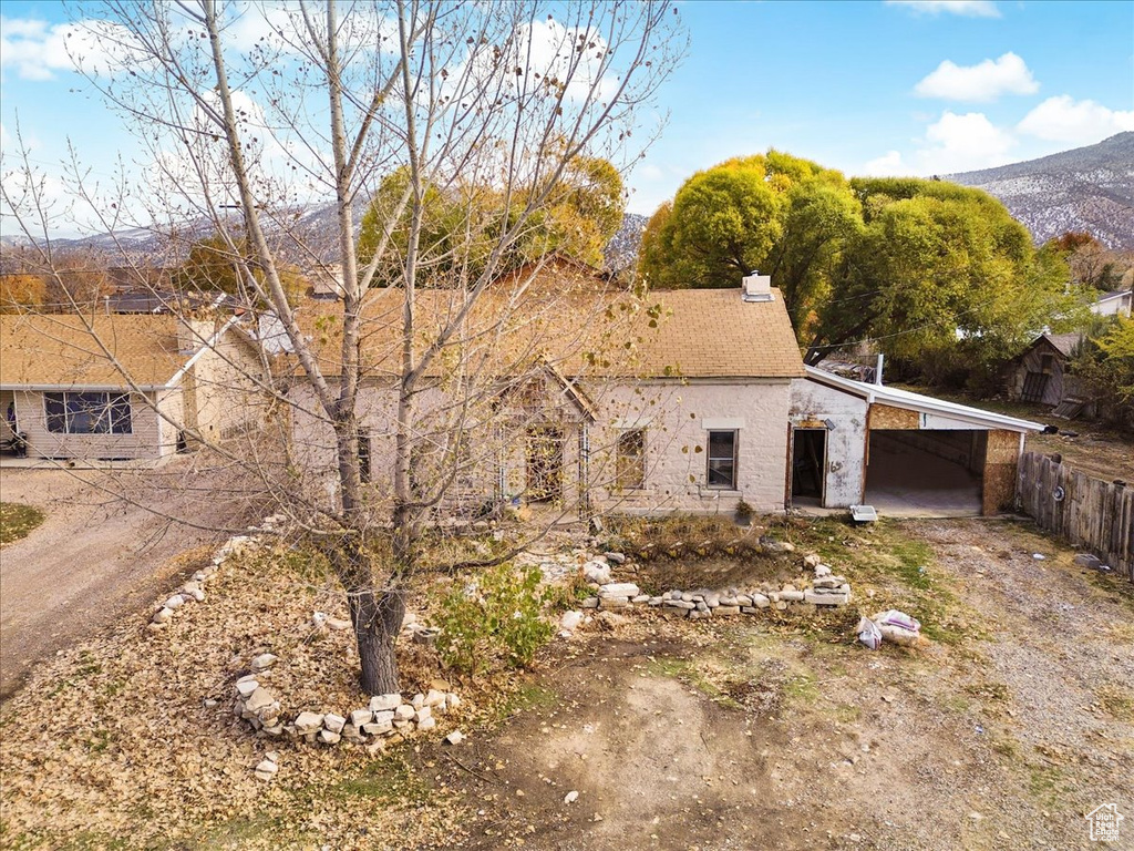 Exterior space with a carport and a mountain view