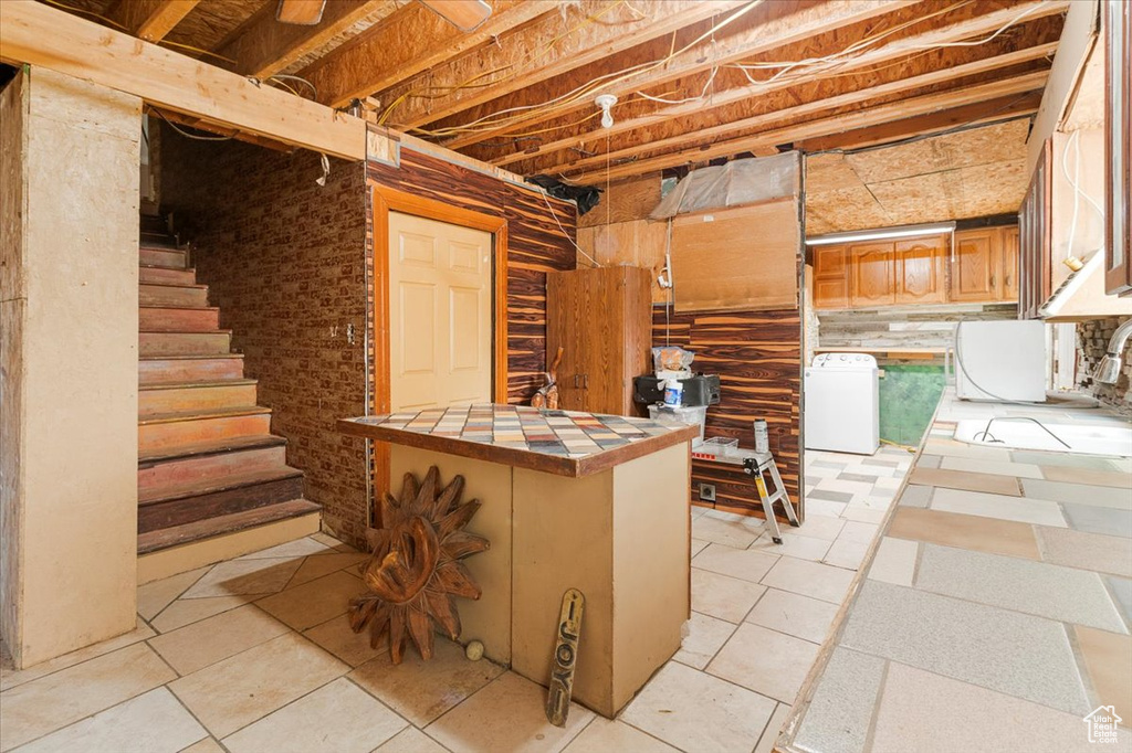 Basement featuring washing machine and clothes dryer