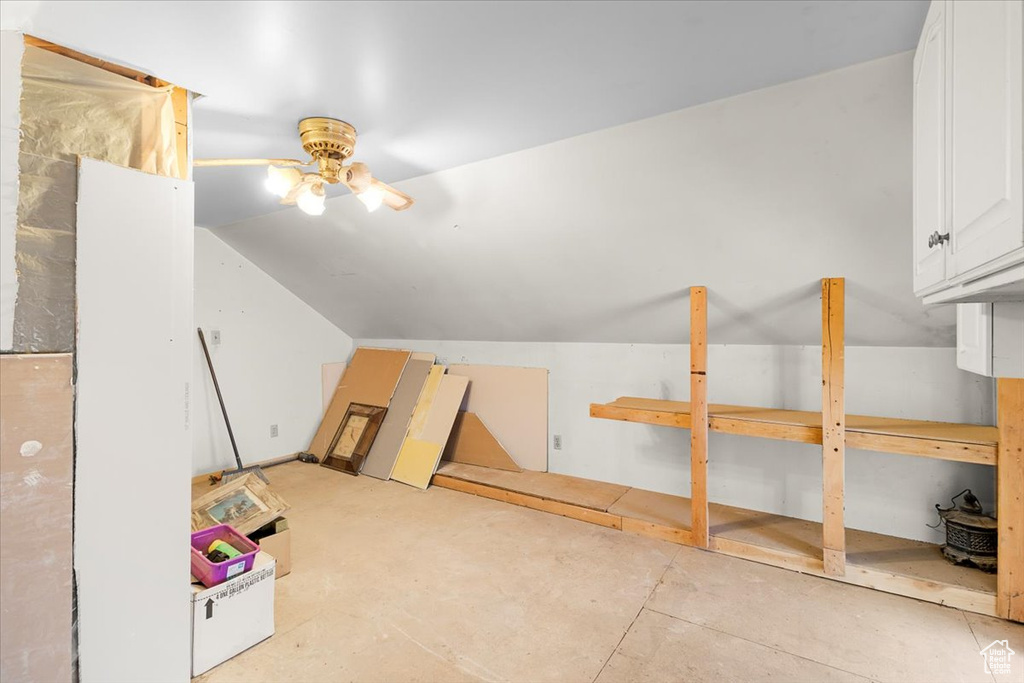 Additional living space featuring ceiling fan and lofted ceiling