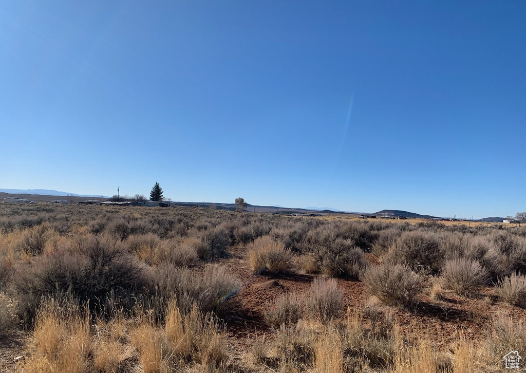 Property view of mountains with a rural view