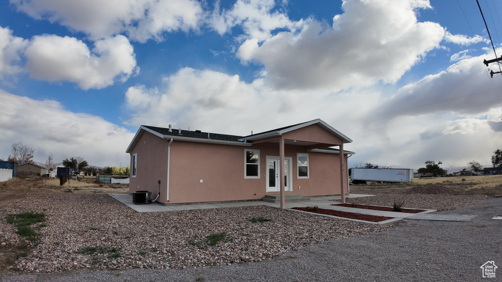 Exterior space with central air condition unit and a patio