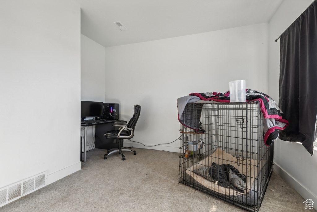 Home office with light carpet