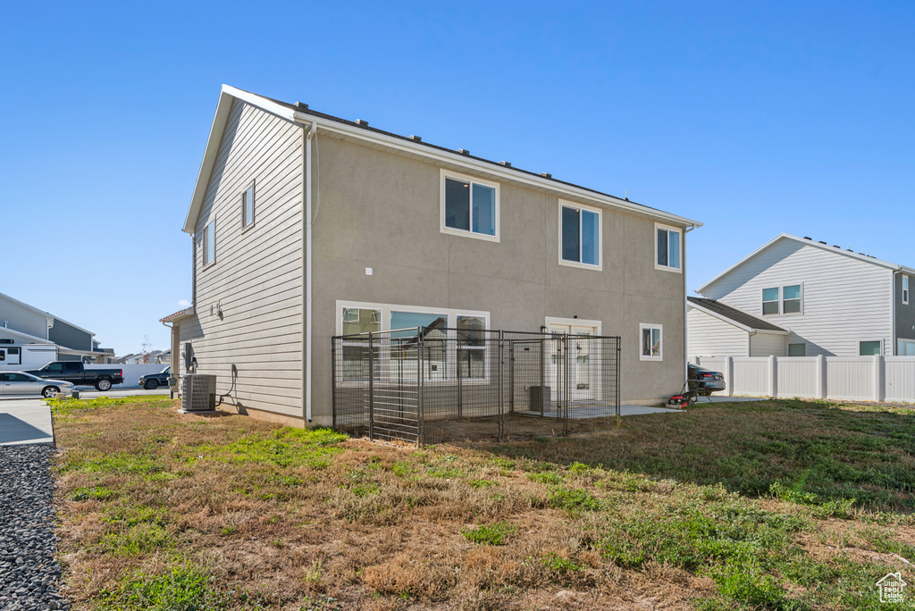 Back of property with central AC unit