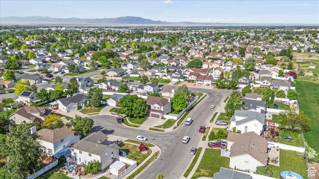 Aerial view of property\\\\\\\'s location with a mountain backdrop and nearby suburban area