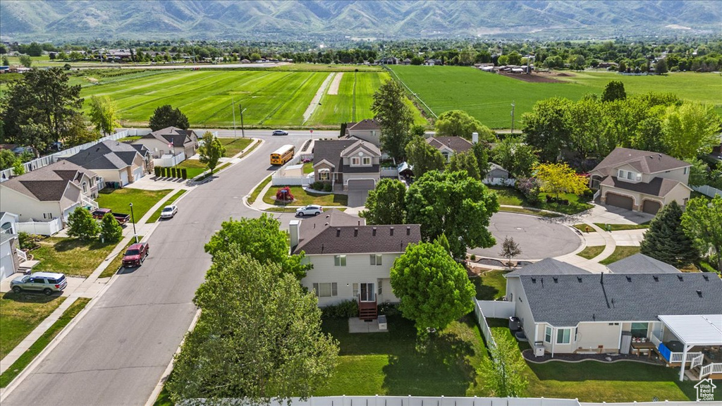 Aerial perspective of suburban area featuring a mountainous background