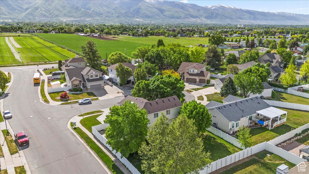 Aerial perspective of suburban area featuring a mountain backdrop