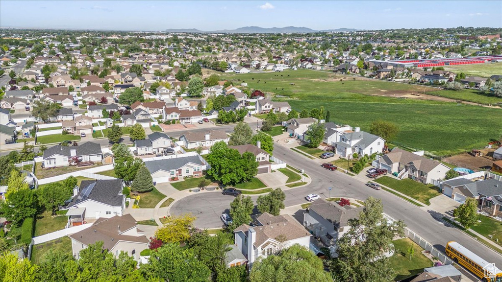 Aerial view of residential area with a mountainous background