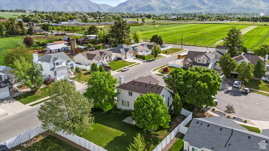 Aerial view of residential area featuring a mountainous background