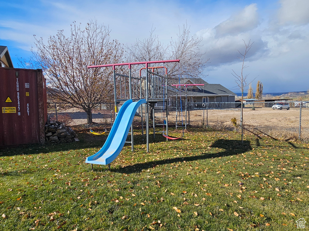 View of play area with a yard