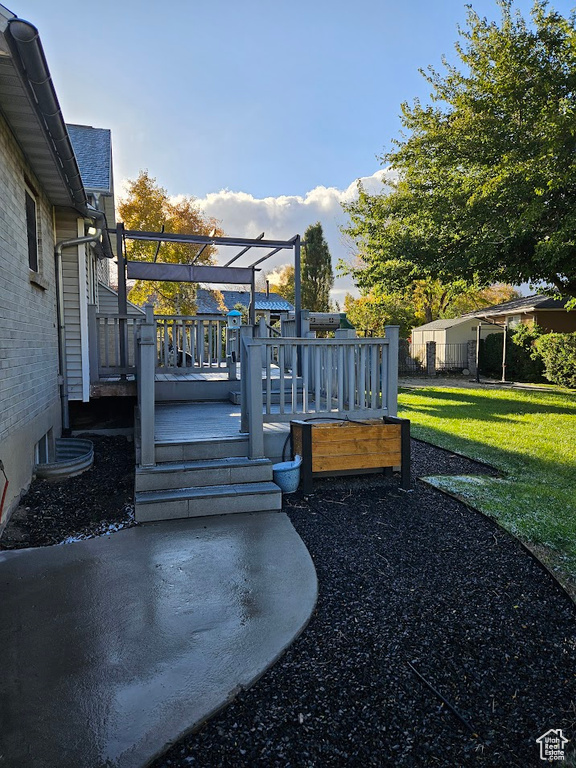 View of yard featuring a wooden deck