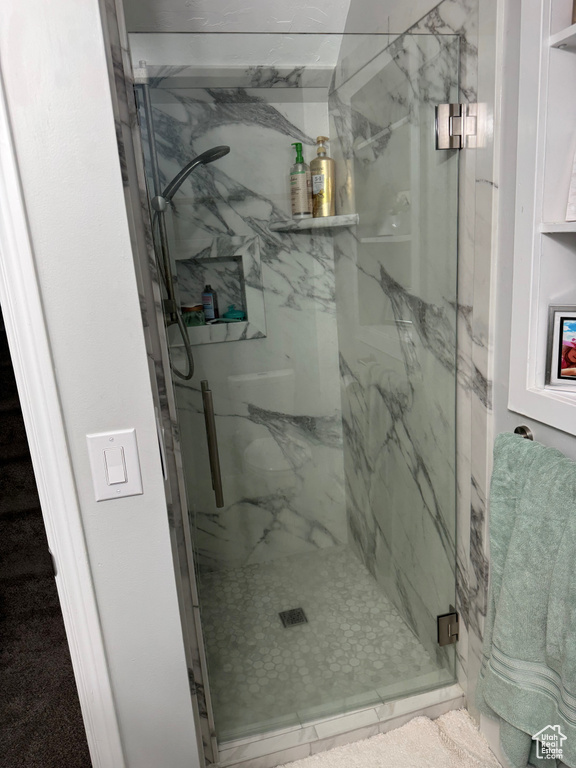 Bathroom featuring a shower with shower door