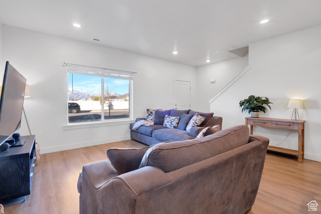 Living room with light wood-type flooring