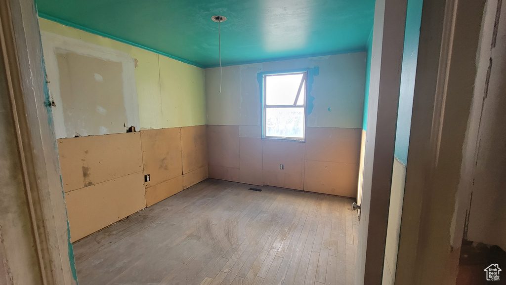 Spare room with light hardwood / wood-style floors