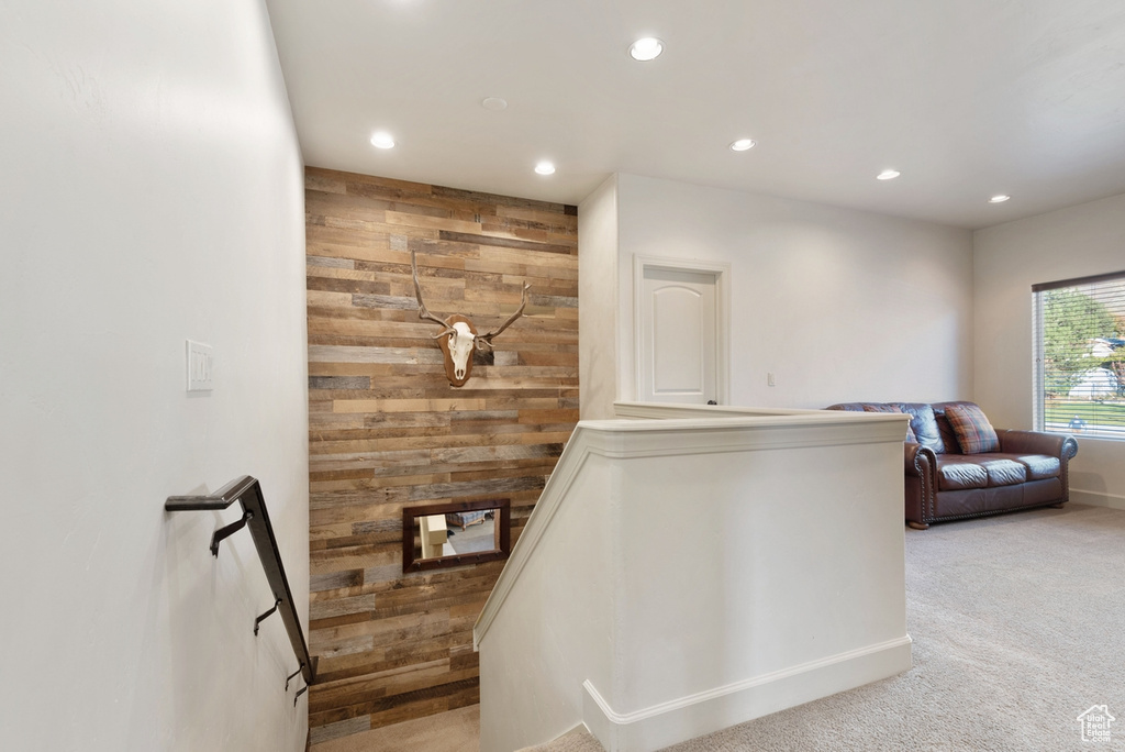 Stairs with wooden walls and carpet