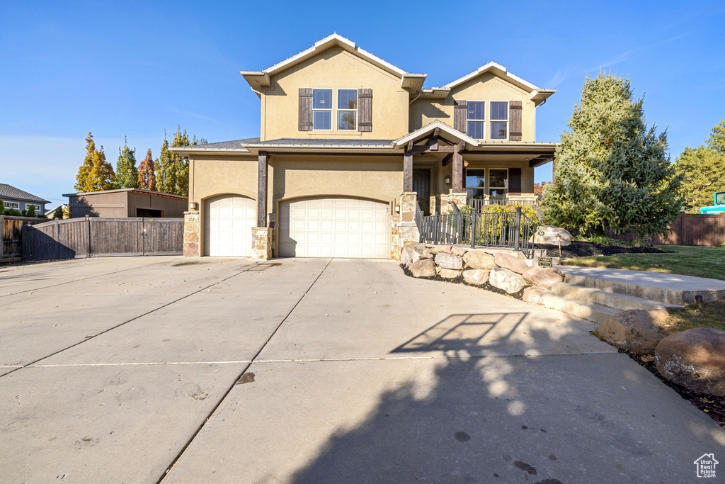 View of front facade featuring a garage