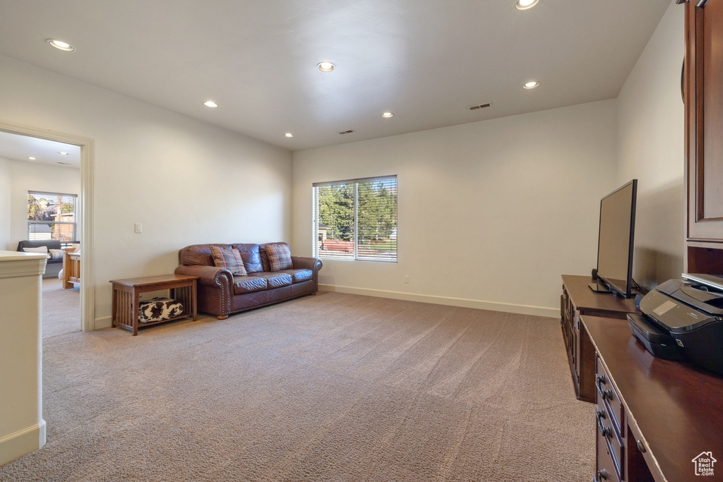 Living room featuring light colored carpet