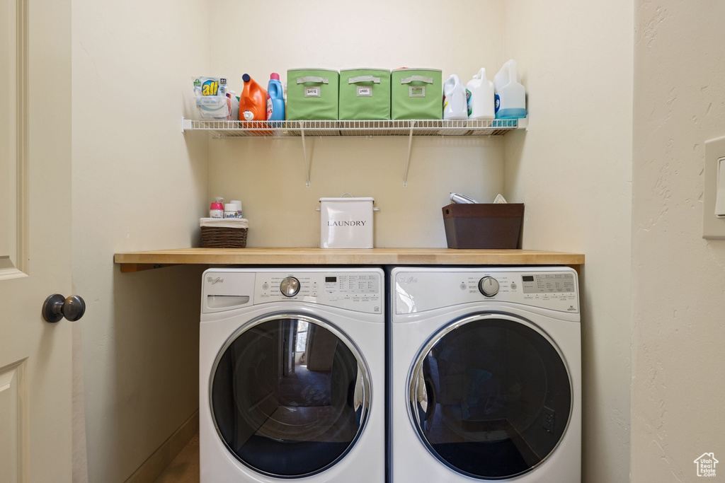 Laundry room with washing machine and dryer