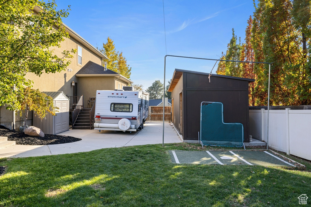 View of yard with a shed